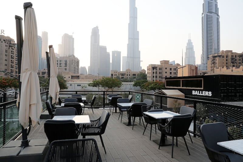 Outdoor seating with Burj Khalifa views.