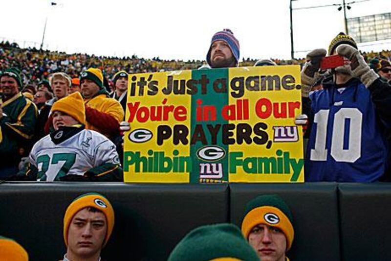 Fans show their support for Green Bay Packers offensive coordinator Joe Philbin, whose son passed away this week.