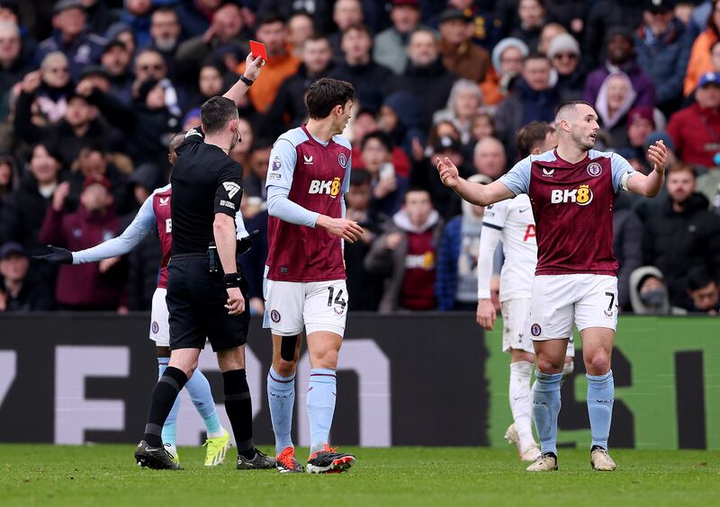 John McGinn of Aston Villa is shown a red card by referee Chris Kavanagh. Getty Images