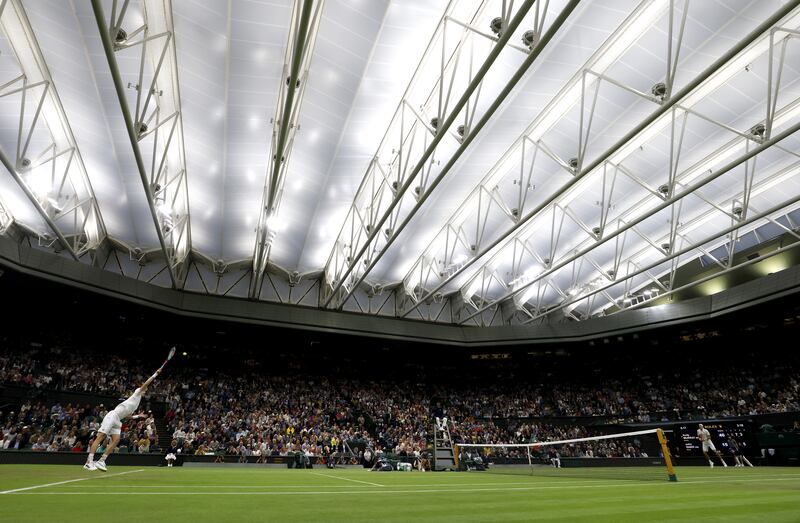 Great Britain's Andy Murray in action against USA's John Isner. PA