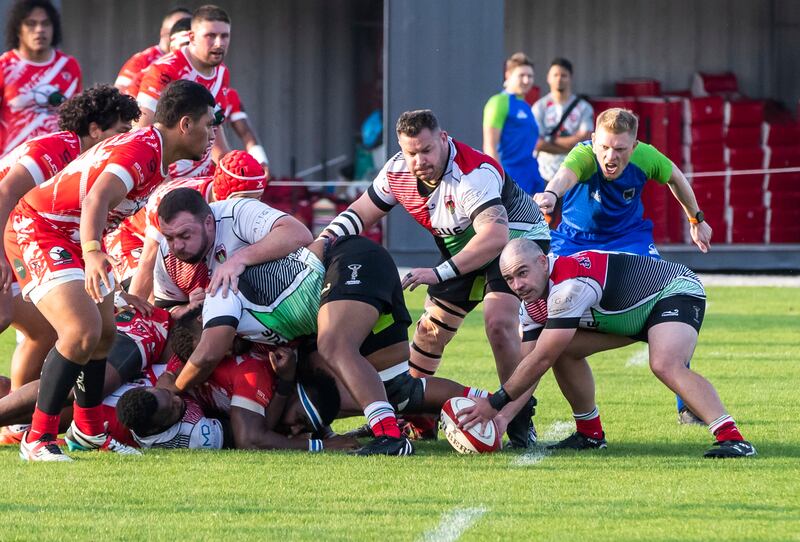 Ben Sapwell-West of Abu Dhabi Harlequins prepares to pass the ball.