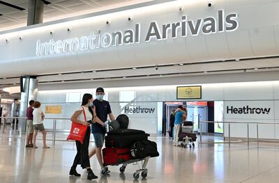 At present, travellers from the UAE must quarantine on arrival in the UK. AFP