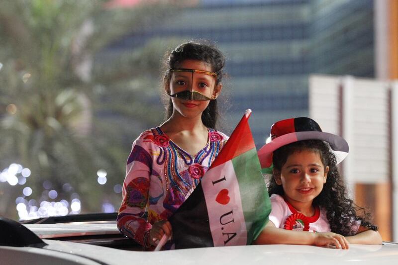 Children enjoy themselves at the Abu Dhabi Corniche on Monday evening. Mona Al-Marzooqi / The National