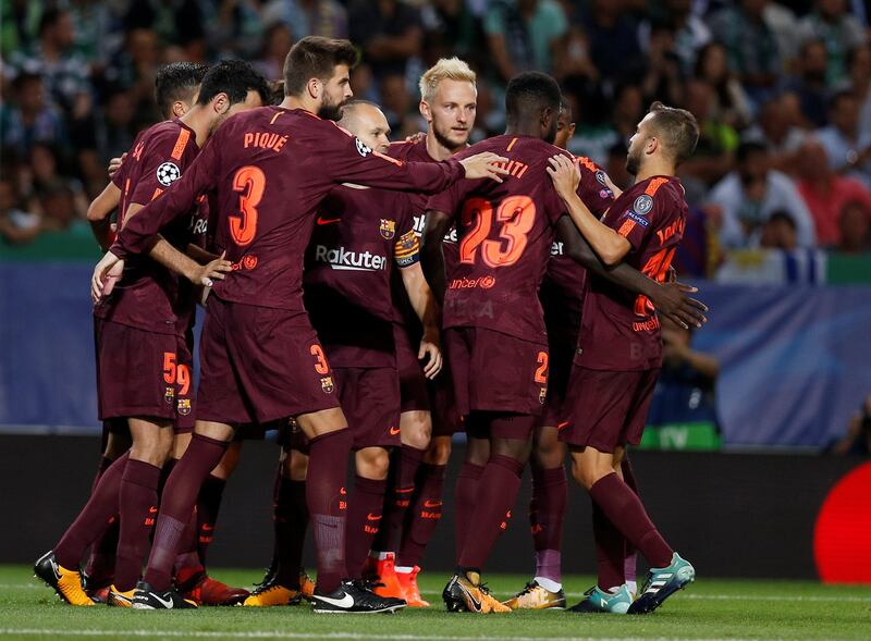 Barcelona’s Andres Iniesta, Gerard Pique and teammates celebrate the first goal. Pedro Nunes / Reuters