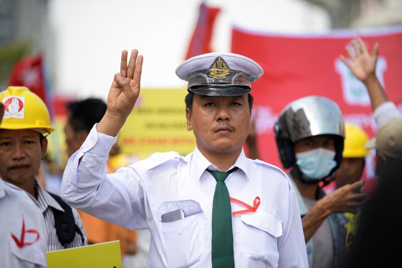 A demonstrator shows the three-finger salute during a protest against the military coup in Yangon. REUTERS