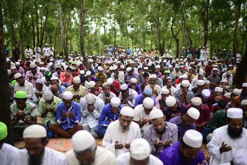 Rohingya refugees offer Eid prayer at Kutupalong refugee camp in Ukhiya near the Bangladesh-Myanmar border on September 2, 2017.
Rohingya refugees marked Eid on September 2 with feasts and prayers in Bangladesh's Cox's Bazar after deadly communal violence in neighbouring Myanmar.
 / AFP PHOTO / STR