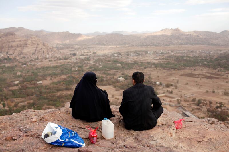 WADI DHAR, SANA'A, YEMEN - February 5, 2010: A couple enjoys the view from a lookout point overlooking Wadi Dhar, outside of Sana'a, Yemen. ( Ryan Carter / The National ) 

