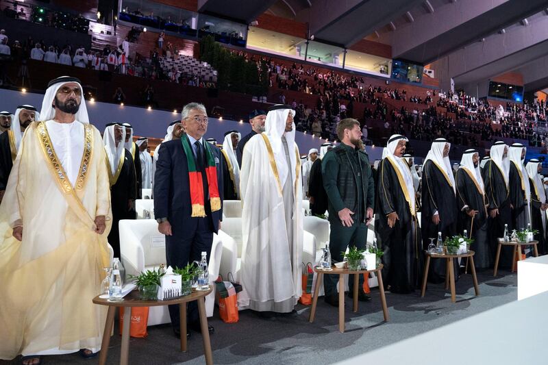 ABU DHABI, UNITED ARAB EMIRATES - December 02, 2019: (L-R) HH Sheikh Mohamed bin Rashid Al Maktoum, Vice-President, Prime Minister of the UAE, Ruler of Dubai and Minister of Defence, HM King Abdullah Ri’ayatuddin Al-Mustafa Billah Shah of Malaysia, HH Sheikh Mohamed bin Zayed Al Nahyan, Crown Prince of Abu Dhabi and Deputy Supreme Commander of the UAE Armed Forces, HE Ramzan Kadyrov, President of Chechnya, HH Sheikh Humaid bin Rashid Al Nuaimi, UAE Supreme Council Member and Ruler of Ajman, HH Sheikh Hamad bin Mohamed Al Sharqi, UAE Supreme Council Member and Ruler of Fujairah, HH Sheikh Tahnoon bin Mohamed Al Nahyan, Ruler's Representative in Al Ain Region, HH Sheikh Sultan bin Mohamed Al Qasimi, Crown Prince of Sharjah, HH Sheikh Rashid bin Saud bin Rashid Al Mu'alla, Crown Prince of Umm Al Quwain and HH Sheikh Hamdan bin Zayed Al Nahyan, Ruler’s Representative in Al Dhafra Region, stand for the UAE national anthem, during the 48th UAE National Day celebrations 'Legacy of Our Ancestors', at Zayed Sports City.

( Ryan Carter for the Ministry of Presidential Affairs )
---