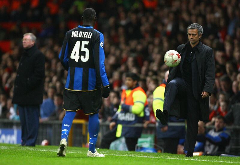 MANCHESTER, UNITED KINGDOM - MARCH 11:  Inter Milan Manager Jose Mourinho returns the ball to Mario Balotelli of Inter Milan as Manchester United Manager Sir Alex Ferguson looks on during the UEFA Champions League Round of Sixteen, Second Leg match between Manchester United and Inter Milan at Old Trafford on March 11, 2009 in Manchester, England.  (Photo by Alex Livesey/Getty Images)