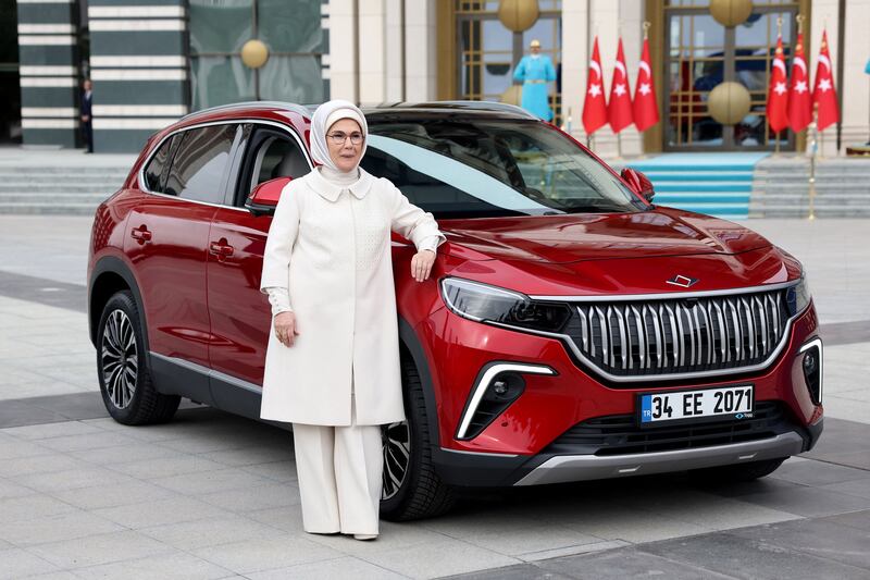 Ms Erdogan poses with her new car 