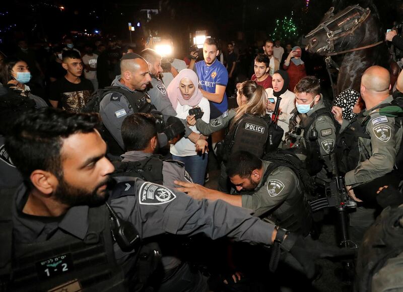 Prominent Palestinian activist Muna El-Kurd reacts during scuffles with Israeli police amid ongoing tension ahead of an upcoming court hearing in an Israeli-Palestinian land-ownership dispute in the Sheikh Jarrah neighbourhood of East Jerusalem, May 4, 2021. REUTERS/Ammar Awad