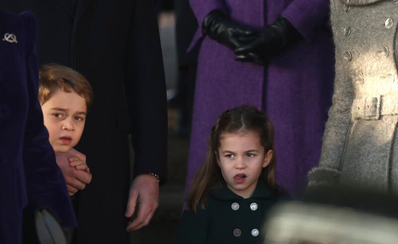 Britain's Prince George and his sister Princess Charlotte after attending a Christmas day service at the St Mary Magdalene Church in Sandringham in Norfolk. AP