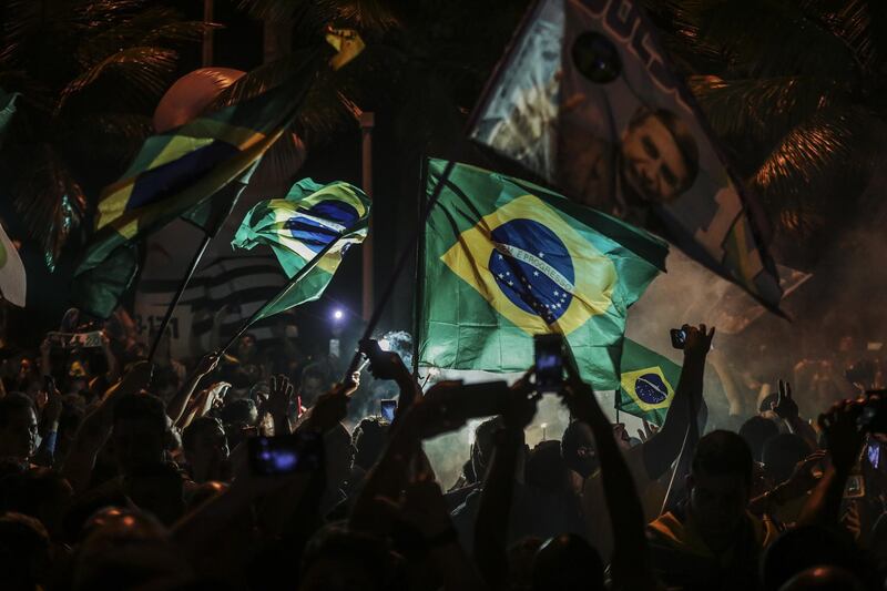 Supporters of Jair Bolsonaro celebrate his victory in Rio de Janeiro. EPA