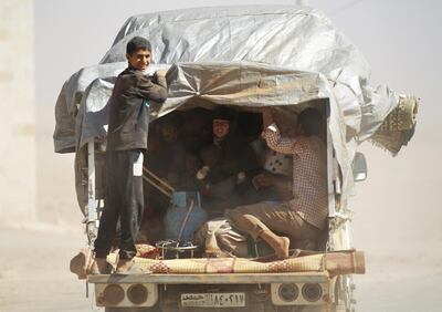 People, who fled from Islamic State-controlled areas, ride a pick-up truck upon their arrival in Turkman Bareh village, after rebel fighters advanced in the area, in northern Aleppo Governorate, Syria, October 7, 2016. REUTERS/Khalil Ashawi