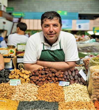 Many stalls in Almaty's Green Bazaar are run by three generations of the same family. Nick Walton