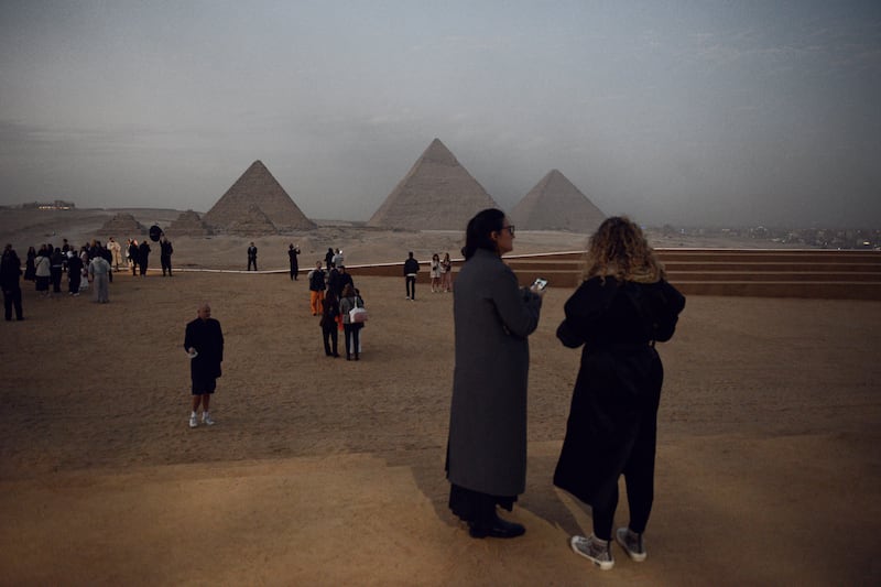 Guests arrive for the show at the Pyramids of Giza. Getty Images
