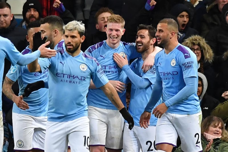 Manchester City's Belgian midfielder Kevin De Bruyne celebrates with teammates after scoring their second goal in the Premier League match against West Ham United at the Etihad. AFP