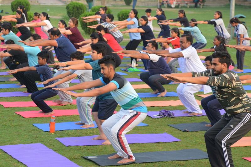 Indian yoga practitioners take part in a yoga session ahead of International Yoga Day at a park in Amritsar.  Narinder Nanu / AFP Photo