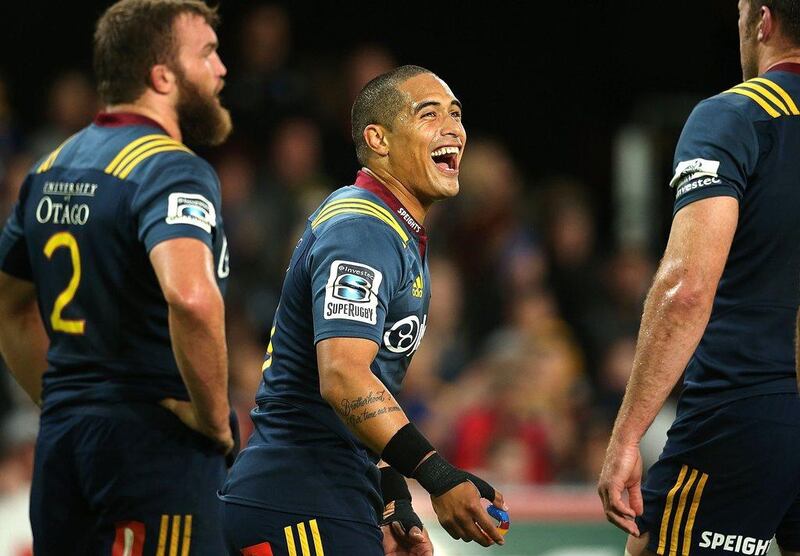 Aaron Smith of the Highlanders smiles with teammates during their Super Rugby win over Golden Lions on Saturday. Martin Hunter / AFP / March 12, 2016 