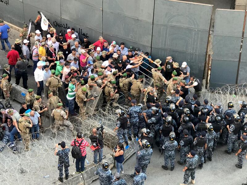 Veterans tussle with the Lebanese army and police during a protest over cuts to their pension service in Beirut, Lebanon. Reuters