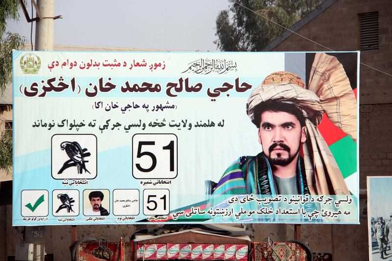 epa07081160 Election campaign poster of Haji Saleh Muhammad Khan Achakzai, a candidate for the upcoming Parliamentary elections, is installed on a road in Helmand, Afghanistan, 09 October 2018. Saleh Muhammad and seven other people were killed after a suicide bomber attacked the candidate's campaign office in Lashkar Gah, the capital of the restive Afghan province of Helmand. The Taliban on 08 October appealed to the people of Afghanistan to boycott the upcoming parliamentary elections in the country, calling them an attempt to legitimize the presence of foreign troops in the country. The elections, is set for 20 October 2018.  EPA/WATAN YAR