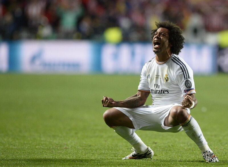 Real Madrid defender Marcelo celebrates after scoring his side's third goal in extra time of the Champions League final on Saturday against Atletico Madrid. Franck Fife / AFP / May 24, 2014