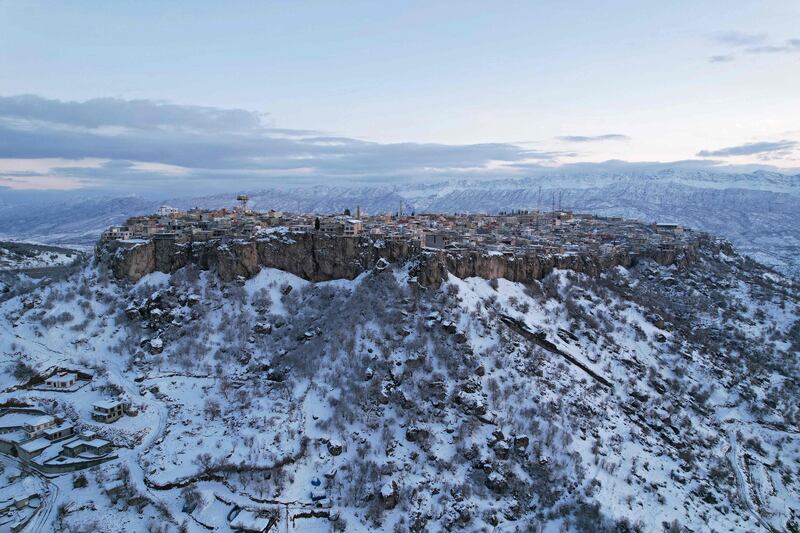 An aerial view shows the snow-covered mountains surrounding the town of Amadiyah, 1,400 metres above sea level and located about 75 kilometres north of the city of Dohuk in the autonomous Iraqi Kurdistan region on January 17.  AFP