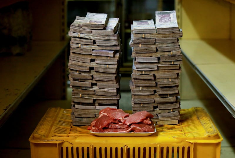 A kilogram of meat is pictured next to 9,500,000 bolivars