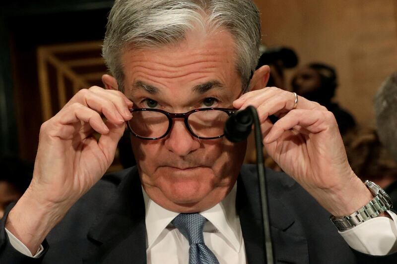 FILE PHOTO: Federal Reserve Board Chairman Jerome Powell prepares to testify before a Senate Banking Housing and Urban Affairs Committee hearing on the The Semiannual Monetary Policy Report to the Congress, on Capitol Hill in Washington, U.S., March 1, 2018. REUTERS/Yuri Gripas/File Photo