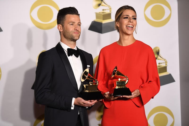 Songwriters Ben Fielding and Brooke Ligertwood, winners of Best Contemporary Christian Music Performance/Song pose in the press room during the 60th Annual Grammy Awards. AFP