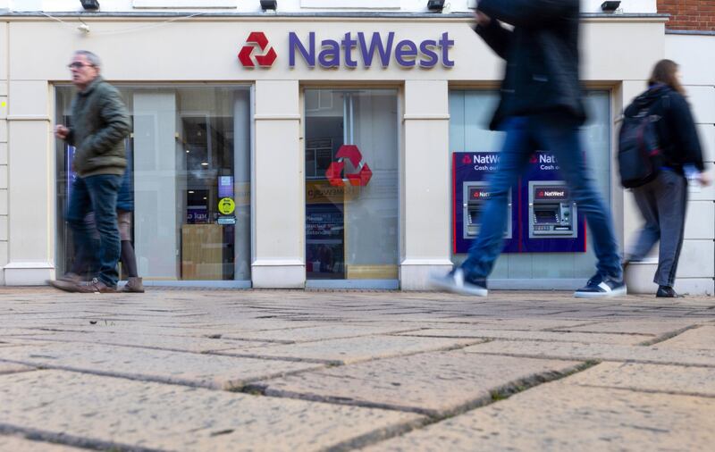 Pedestrians pass a NatWest Group branch in Chelmsford, UK. The bank posted an operating pre-tax profit of £4bn for 2021. Bloomberg