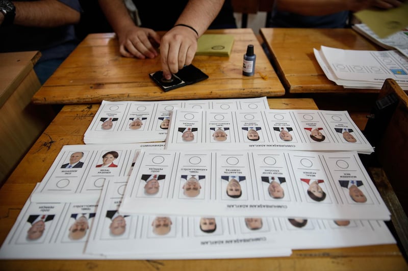 Presidential candidates are seen on a ballot paper as people start casting their votes at a polling station in Ankara, Turkey, on June 24, 2018. Mustafa Kirazli / Getty Images