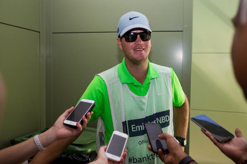 Caddie David Buhai talks to reporters after proposing to his girlfriend, European Tour player Ashleigh Simon on Saturday at the Dubai Ladies Masters. Tristan Jones / European Tour