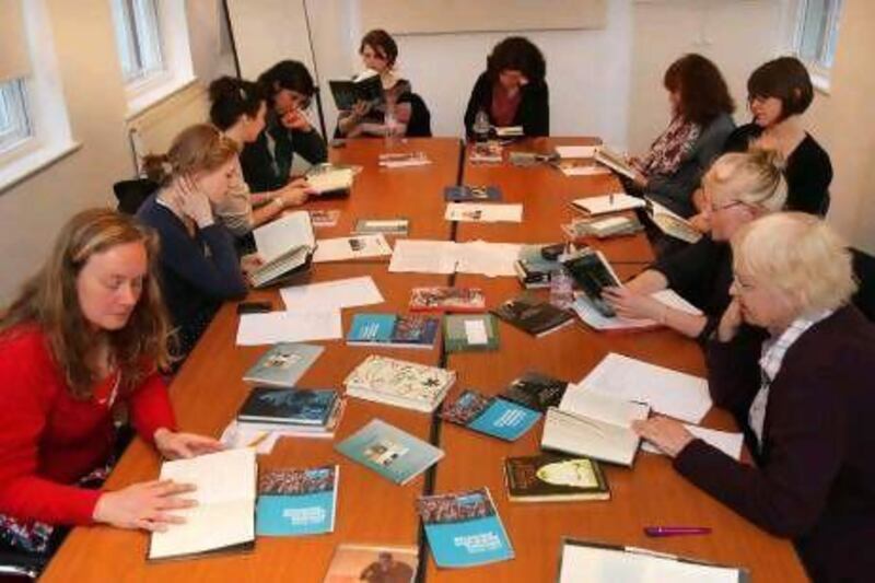 Members listen to a reading at the first meeting of the Banipal book club in London. Stephen Lock for The National