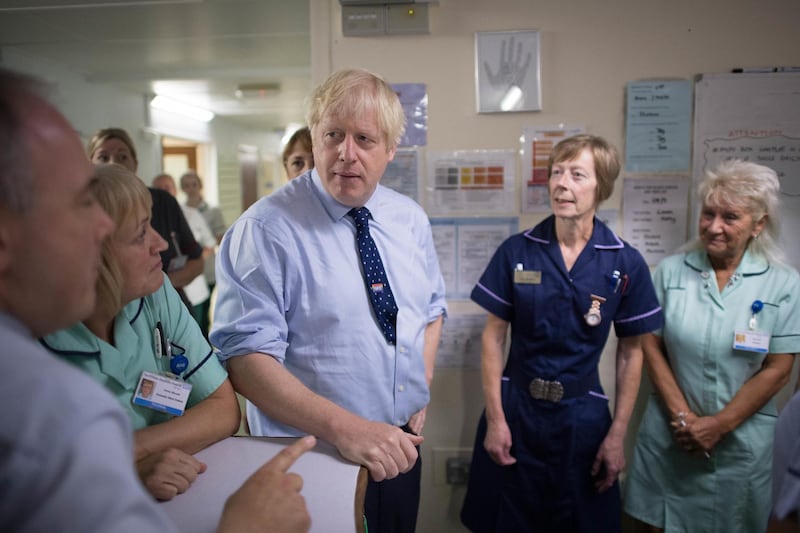 HARLOW, ENGLAND - SEPTEMBER 27: Prime Minister Boris Johnson speaks with staff during a visit to the Princess Alexandra hospital for an announcement on new patient scanning equipment on September 27, 2019 in Harlow, United Kingdom. The Prime Minister is pledging an overhaul to cancer screening, with the funding providing 300 diagnostic machines in hospitals across England. (Photo by Stefan Rousseau - WPA Pool/Getty Images)