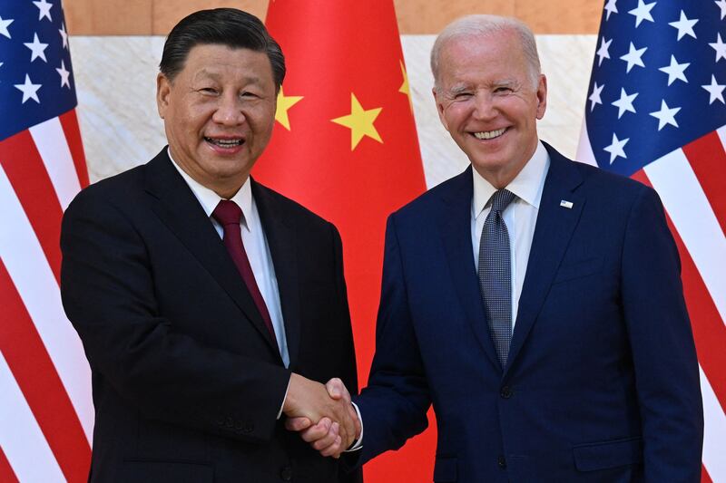 US President Joe Biden, right, and China's President Xi Jinping, left, shake hands at the summit. AFP