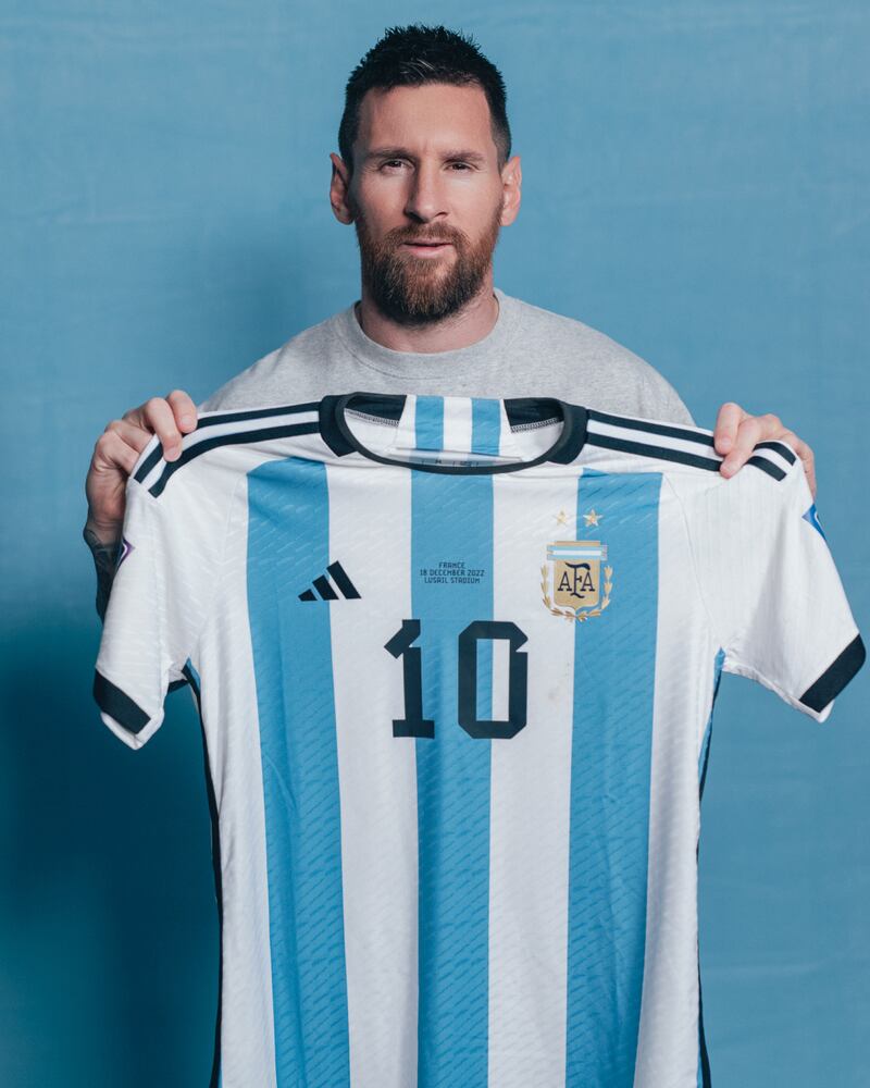 Messi poses with the jersey he wore during the first half of the World Cup final against France. Photo: Sam Robles Photography
