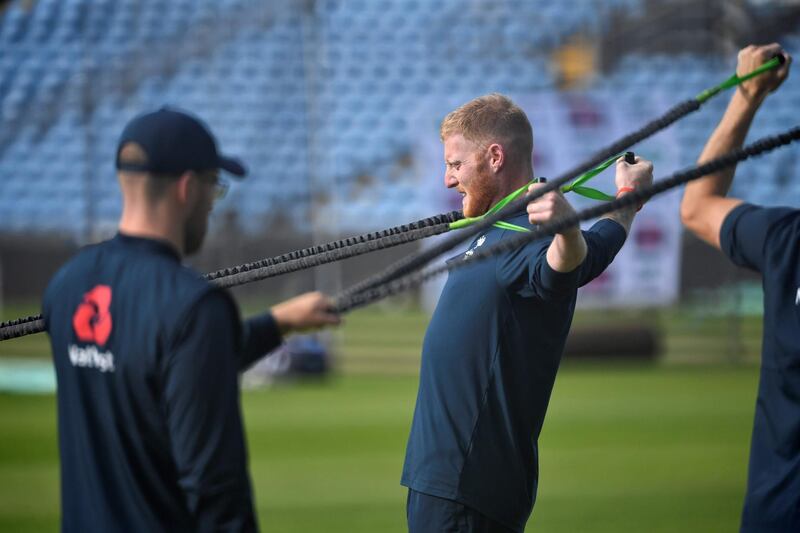 England's Ben Stokes does some stretches. AFP