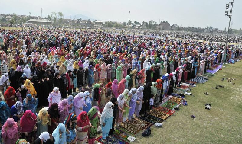 Kashmiri Muslims attend prayers in Srinagar.  EPA
