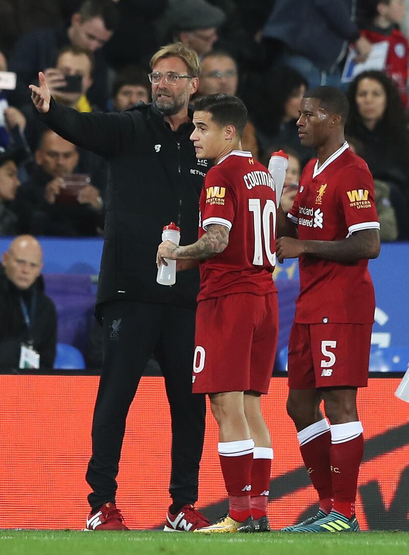 LEICESTER, ENGLAND - SEPTEMBER 19: Jurgen Klopp, Manager of Liverpool speaks with Philippe Coutinho of Liverpool and Georginio Wijnaldum of Liverpool during the Carabao Cup Third Round match between Leicester City and Liverpool at The King Power Stadium on September 19, 2017 in Leicester, England.  (Photo by Matthew Lewis/Getty Images)