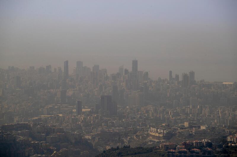 This picture taken from the Beirut-Damascus highway, overlooking the Mediterranean Sea, shows the city of Beirut during unusually warm weather as temperatures reached in Beirut 38 degrees Celsius, 100.4 Fahrenheit, in Aley village, Mount Lebanon, Wednesday, May 20, 2020. (AP Photo/Hassan Ammar)