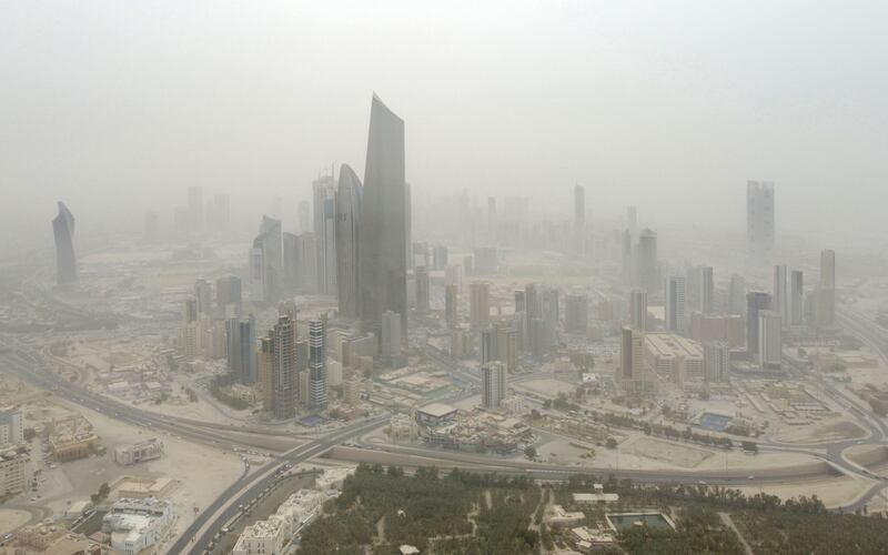 An aerial view shows Kuwait City during a dust storm. AFP