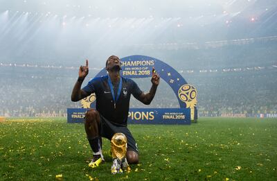 MOSCOW, RUSSIA - JULY 15:  Paul Pogba of France celebrates with the World Cup Trophy following his sides victory in the 2018 FIFA World Cup Final between France and Croatia at Luzhniki Stadium on July 15, 2018 in Moscow, Russia.  (Photo by Matthias Hangst/Getty Images)