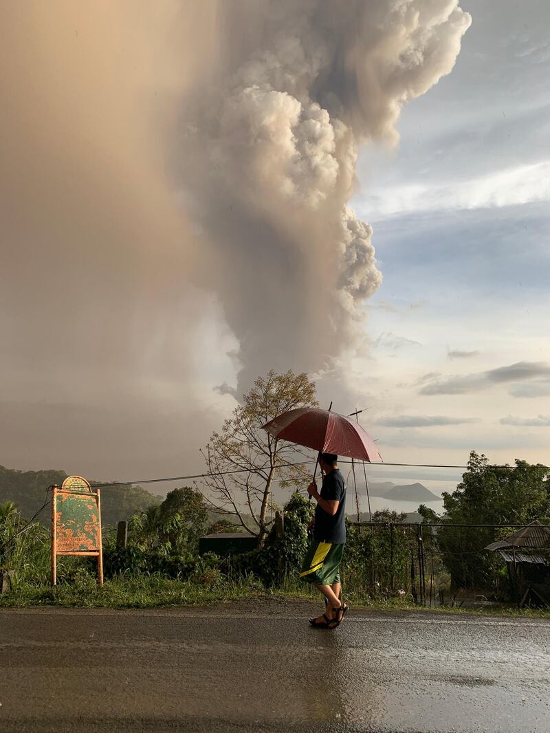 An ash column from erupting Taal Volcano looms over Tagaytay city, Philippines. EPA