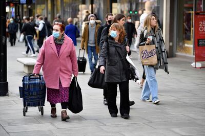 Boris Johnson is imposing 'Plan B' measures on millions of people in the run-up to Christmas. The rules will mean vaccine passports are required at large venues and face masks must be worn in some indoor settings. Reuters