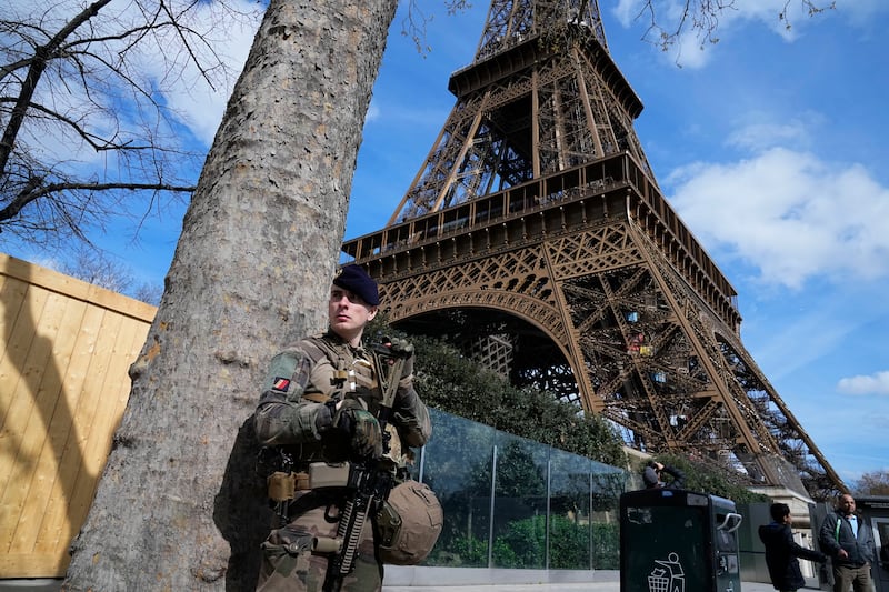 A soldier on patrol at the Eiffel Tower on Monday with France on high alert after the attack in Russia on Friday. AP