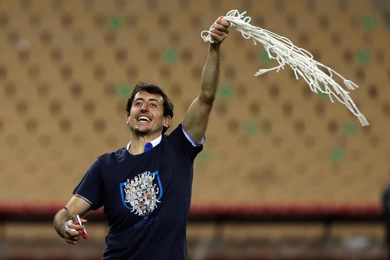 Real Sociedad's winger Mikel Oyarzabal cuts the goal net after winning the 2020 Copa del Rey. EPA