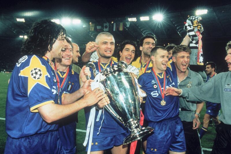 Juventus captain Gianluca Vialli (centre) holds the cup after his team beat AFC Ajax to win the UEFA Champions League Final at the Stadio Olimpico, Rome, 22nd May 1996. The match ended in a 1-1 draw after extra time with Juventus winning 4-2 on penalties. (Photo by Shaun Botterill/Getty Images)