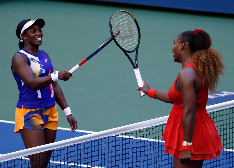Serena Williams taps racquets with Sloane Stephens after their US Open third round match. EPA