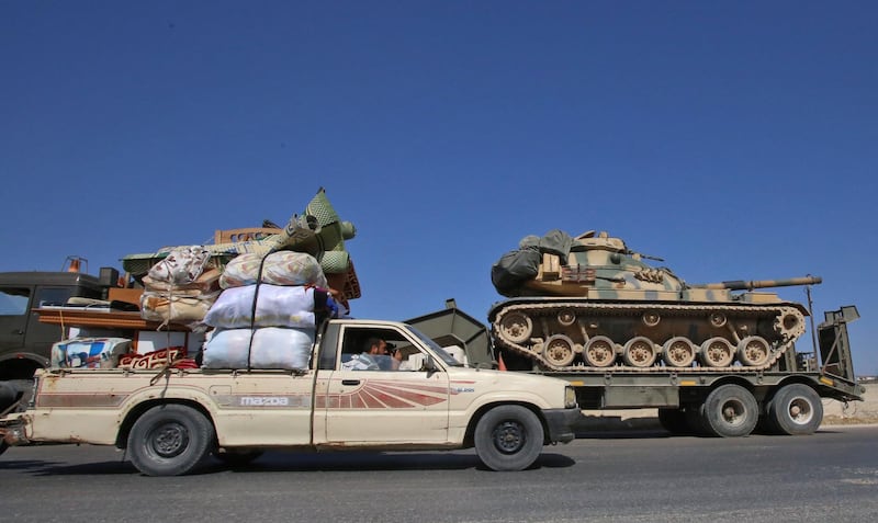 A convoy of Turkish enters as inhabitants flee the battles and shelling toward safer areas.  AFP